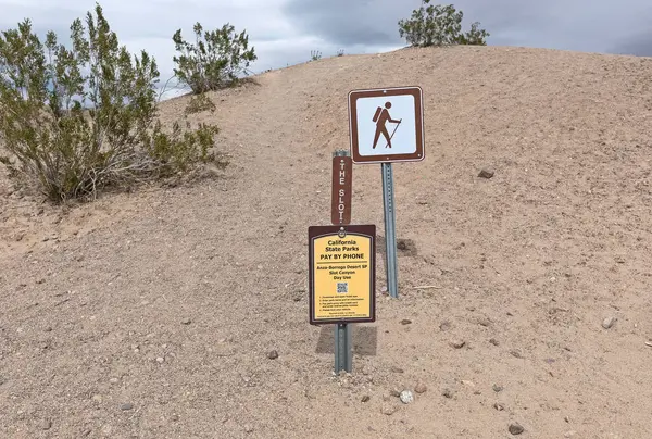 stock image Anza Borrego State Park, California - March 14, 2023: Sign at the trailhead to the Slot canyon. Day time use area. Pay by phone QR code.