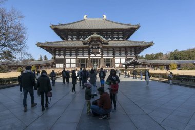 Nara, Japan - December 27, 2023: Front view of the main hall in the Todaiji Temple. One of Japan's most famous and historically significant temples. clipart