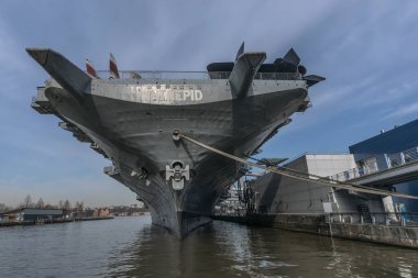 Manhattan, New York City, USA - March 14, 2024: The Intrepid flight museum on an aircraft carrier, located at Pier 86 along the Hudson River in New York clipart