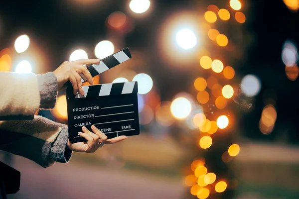 Director Holding Film Slate Outdoors Christmas Movie Set — Stock Photo, Image