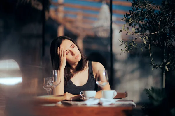 Stressed Woman Sitting Alone in a Restaurant Waiting for her Food
