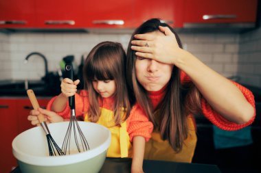 Stressed Mom Supervising her daughter in the Kitchen Cooking clipart