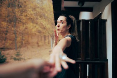 Happy Girlfriend receiving an Engagement Ring for her Partner