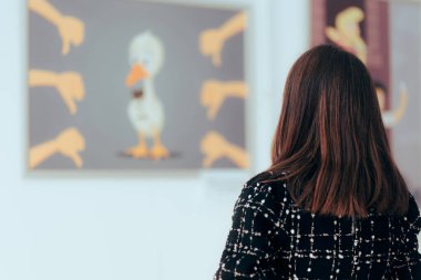 Woman Looking at a Painting in an Art Gallery