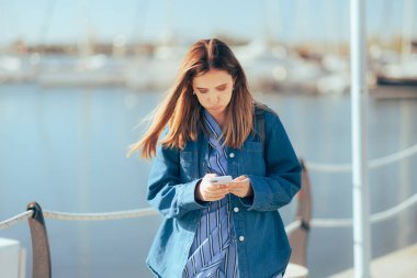 Stressed Tourist Feeling Lost Checking her Phone for Directions