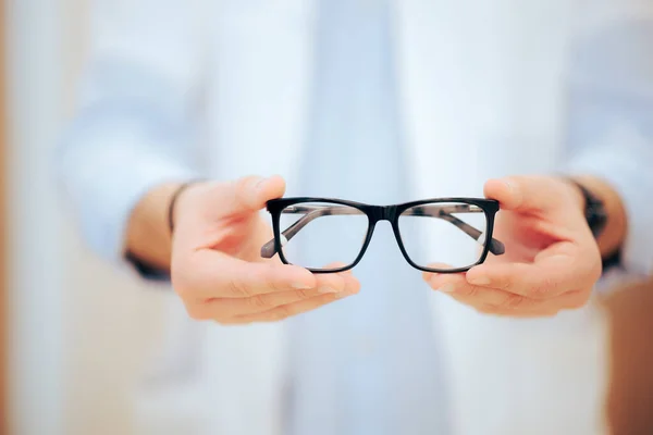 Hands Doctor Holding Prescription Eyeglasses — Stock Photo, Image