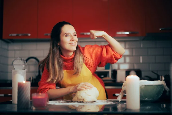 Strong Woman Showing off her Muscles after Kneading Dough