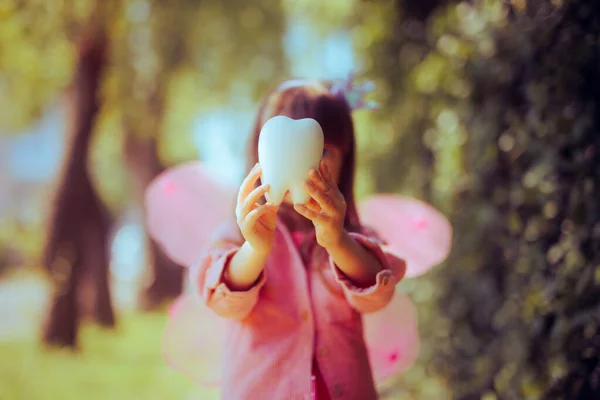Little Girl Tooth Fairy Costume Holding Molar Toy — Stock Photo, Image