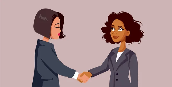Businesswomen Shaking Hands Closing a Deal Vector Cartoon Illustration. Happy business-people greeting with a handshake forming partnership