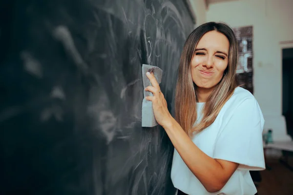 Funny Teacher Wiping the Blackboard Inhaling Chalk Dust