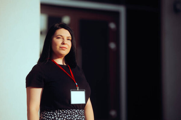  Event Coordinator Standing Wearing a Professional Badge