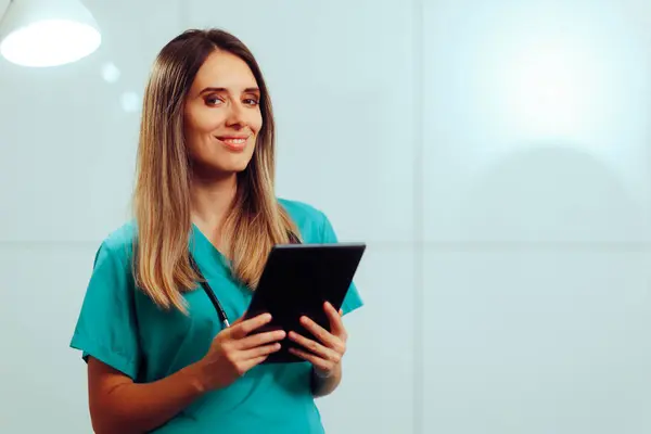 Happy Medical Doctor Holding a Tablet Pc in her Office