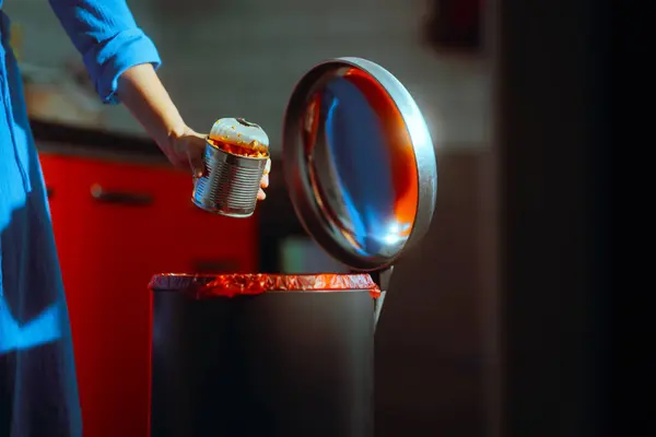 stock image Woman Throwing Away a Spoiled Can of Food 