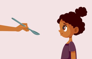 Anne, küçük kızını bir kaşık taşıyıcı çizgi filmiyle besliyor.