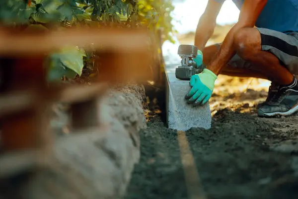 stock image Worker Using a Hammer for Fixing new Curb Blocks