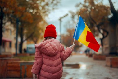 Child Holding a Flag Celebrating Great Union Day in Romania clipart