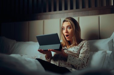 Surprised Pregnant Woman Holding Pc Tablet in Bed clipart