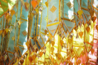 colorful traditional fabric flag decorating hanging in temple