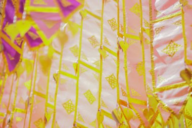 colorful traditional fabric flag decorating hanging in temple