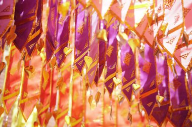 colorful traditional fabric flag decorating hanging in temple
