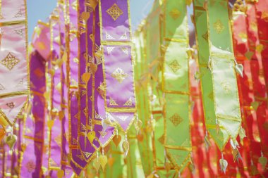 colorful traditional fabric flag decorating hanging in temple