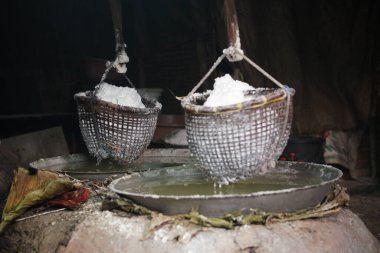 boiling saline solution in pan is traditional way for making mountain rock salt