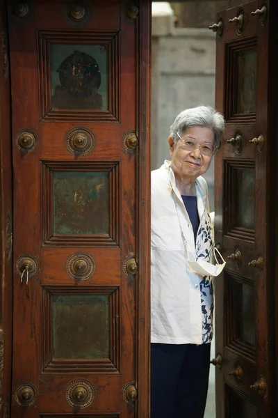 stock image asian old elderly elder senior woman smiling at door