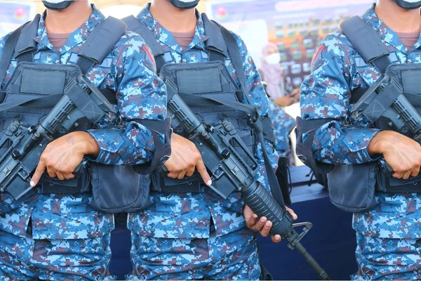 close up A unit of military commandos in uniforms carrying SK guns as their personal weapons is preparing.