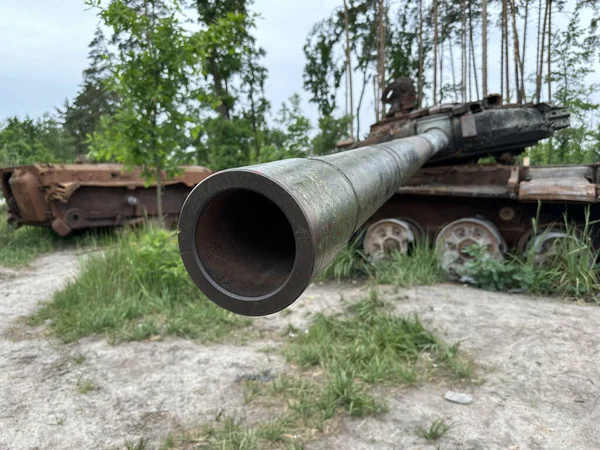 Stock image Armored transport burnt from a shell. Exploded tank, rusty armor, remnants of equipment. Military Russian tank shot down in battle.