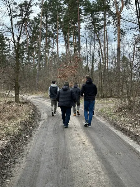 Group Men Walking Forest Road Viewed Rear Group Guys Walking — Stock Photo, Image