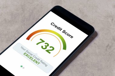 the smartphone lies on the table, shows the credit score application on the screen. bank credit report.