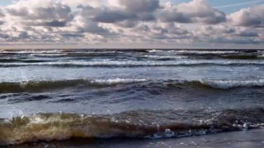 Sandy beach and sea during a storm. Storm in the rainy season