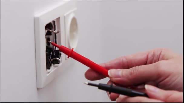 Female Electrician Checks Newly Installed Socket Digital Multimeter — Stock Video
