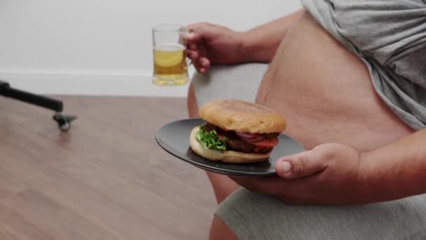 Fat Man Burger Mug Beer Armchair Man Overweight — стоковое видео