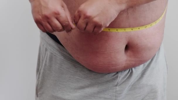 Fat Man Checks His Fat Measuring Tape Obesity — Vídeo de Stock