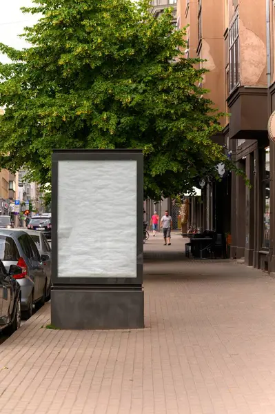 empty billboard on the sidewalk of a city street. billboard mockup