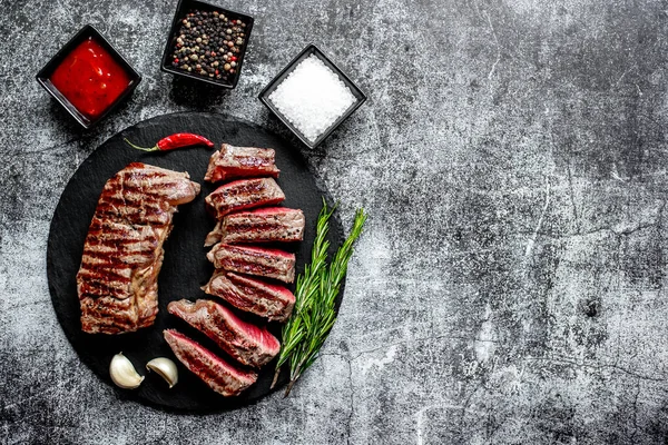 stock image grilled beef steak with spices and vegetables, close up view, food concept