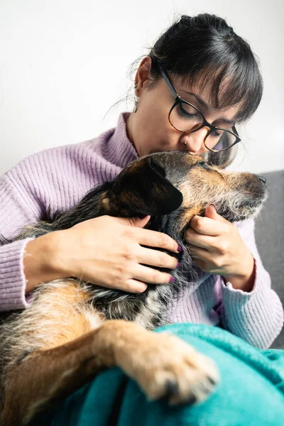 Latin American Woman Wearing Glasses Kissing Her Dog Love Vertical Stockbild