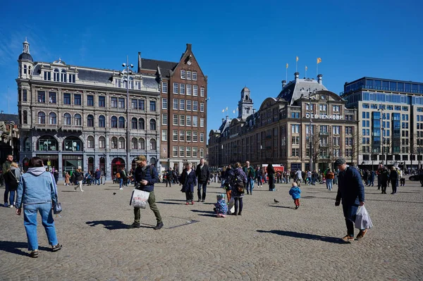 stock image Amsterdam, Nethterlands, April 04, 2023. People at the Dam Square of Amsterdam