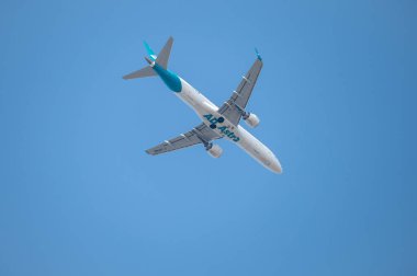 Mainz, Germany - August 31, 2024: Embraer E190 LR from Air Dolomiti flying over Mainz on its way from Katowice to Frankfurt a. M. clipart