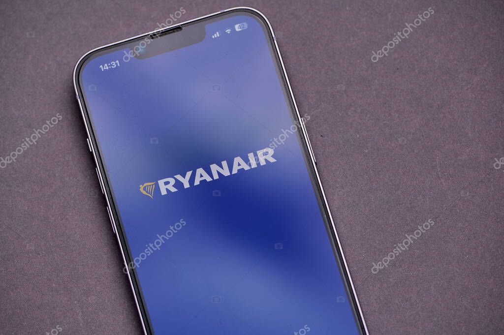 Mainz, Germany - 09 June, 2025: A smartphone shows the user interface of airline application of Ryanair focused on flight bookings and travel updates, featuring a prominent logo.