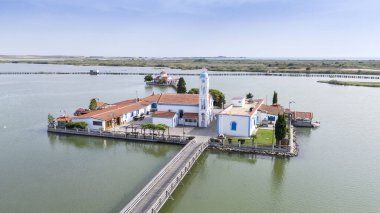 Aerial drone view od Agios Nikolaos Monastery on the Vistonida Lake at Porto Lagos, Greece clipart