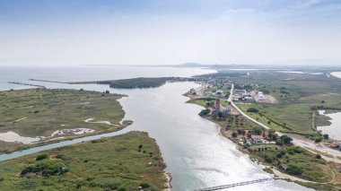 Aerial drone view od Agios Nikolaos Monastery on the Vistonida Lake at Porto Lagos, Greece clipart