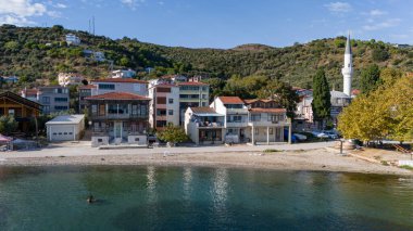 Asmali Village view from sea in Marmara Island of Turkey. Aerial view of Marmara island Cinarli , Turkey. Marmara island view from sea in Turkey. clipart