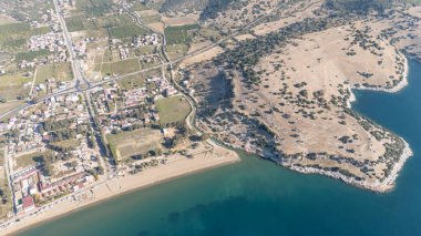 Aerial view over Ahmetbeyli coastal resort town in Menderes district of Izmir province in Turkey. clipart