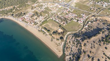 Aerial view over Ahmetbeyli coastal resort town in Menderes district of Izmir province in Turkey. clipart