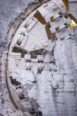 Tunnel boring machine(TBM) head on display at subway construction site ,underground infrastructure transportation clipart