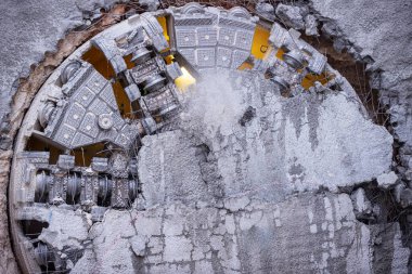 Tunnel boring machine(TBM) head on display at subway construction site ,underground infrastructure transportation clipart