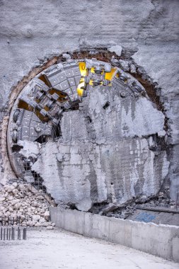 Tunnel boring machine(TBM) head on display at subway construction site ,underground infrastructure transportation clipart