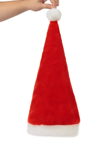 Handen Håller Jultomten Röd Hatt Isolerad Vit Bakgrund Närbild — Stockfoto